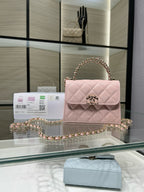 Pink quilted flap handbag with gold-tone chain strap and turn-lock clasp