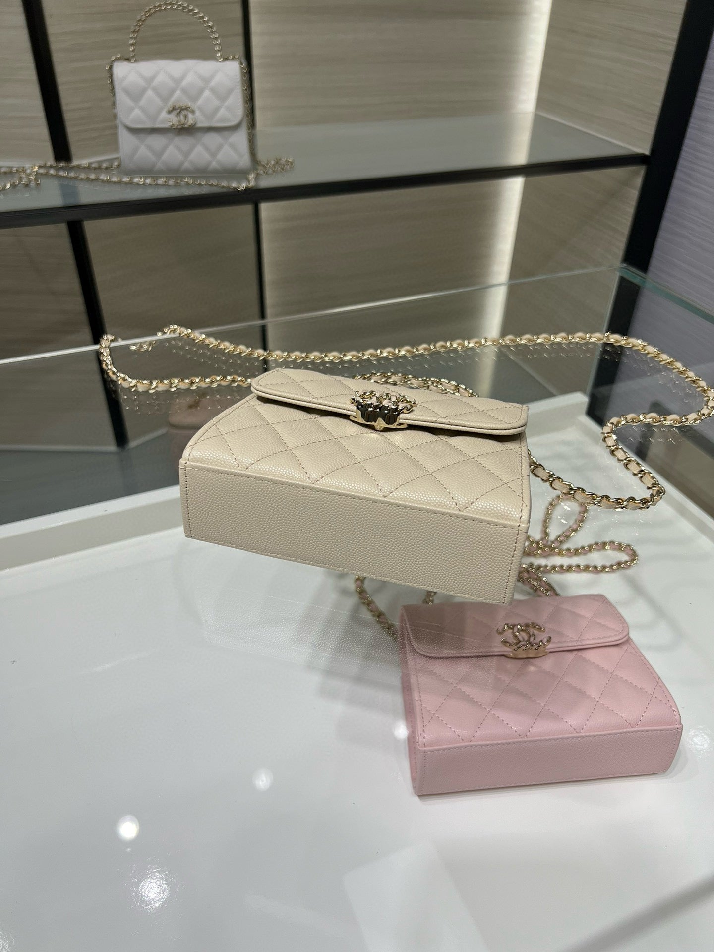 Chanel cream quilted flap shoulder bag with gold chain strap, side angle