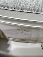 Chanel logo label on cream quilted interior flap, made in Italy text