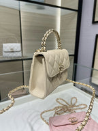 Chanel cream quilted small flap shoulder bag, gold chain strap, side view
