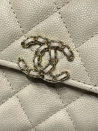 Chanel cream quilted bag with gold-tone chain detail on flap
