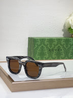Gucci rounded-square sunglasses with dark frames and brown-tinted lenses, side angle