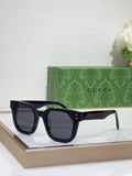 Gucci square sunglasses with dark navy frames and dark tinted lenses, front view