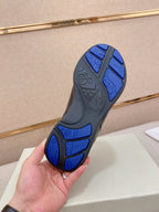 Black sneaker outsole with blue traction pattern