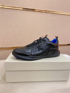Black lace-up sneakers with blue lining and logo-embossed side detail
