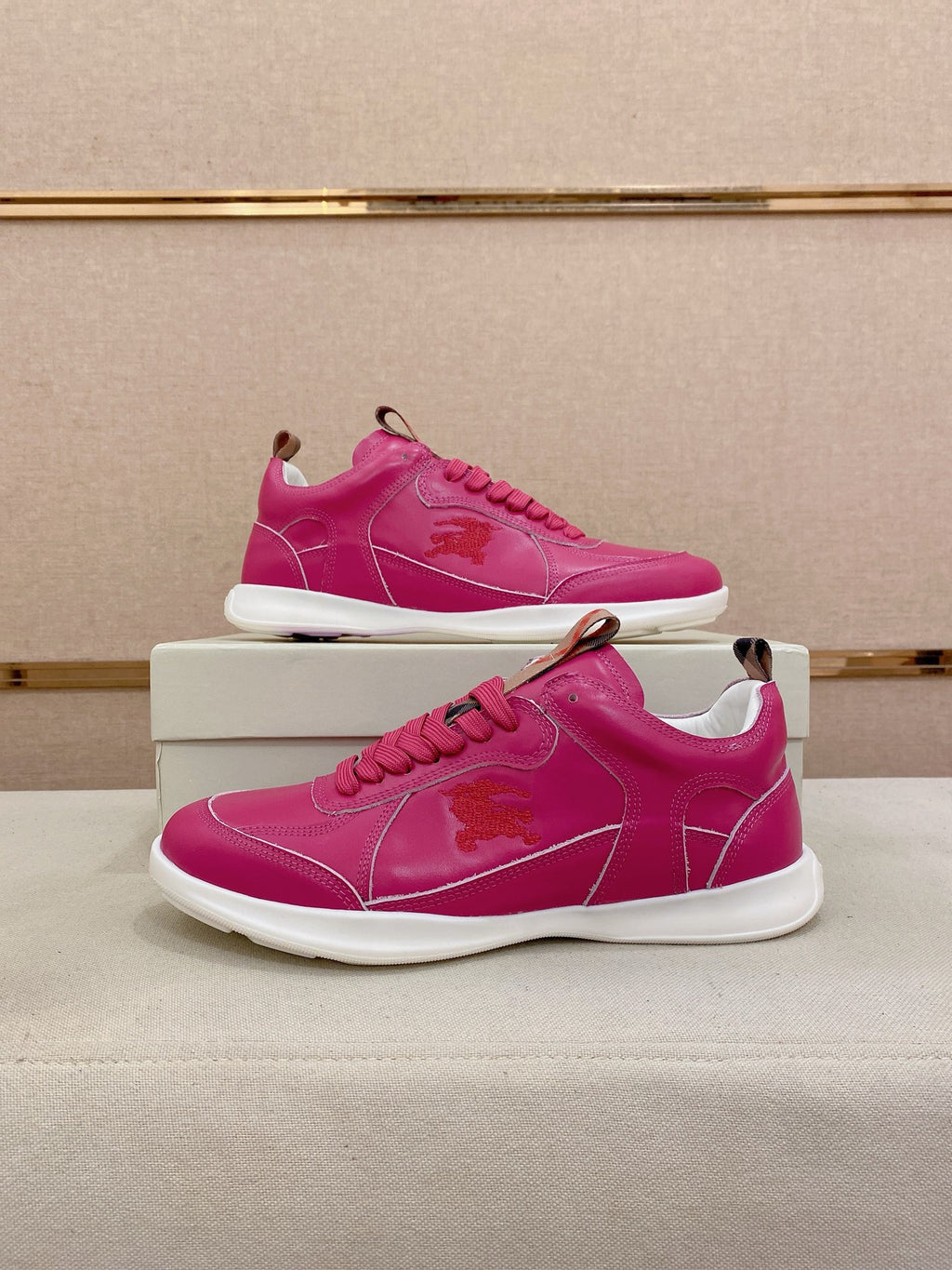Burberry pink low-top sneakers, pair on box with lace-up and logo