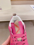 Burberry pink sneakers, close-up of tongue with check-pattern strap detail