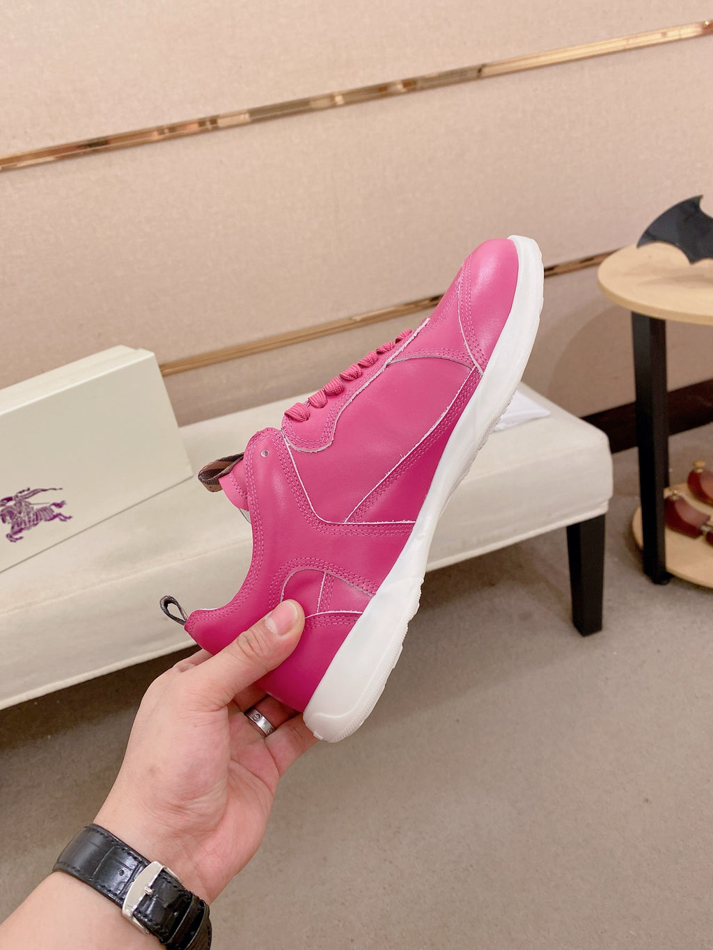 Burberry pink low-top sneakers, hand-held profile with laces and logo