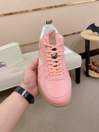 Burberry pink sneaker showing lace-up rows, side panels, and gum sole