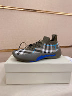Knit sock sneakers in gray with black-and-white plaid and blue trim