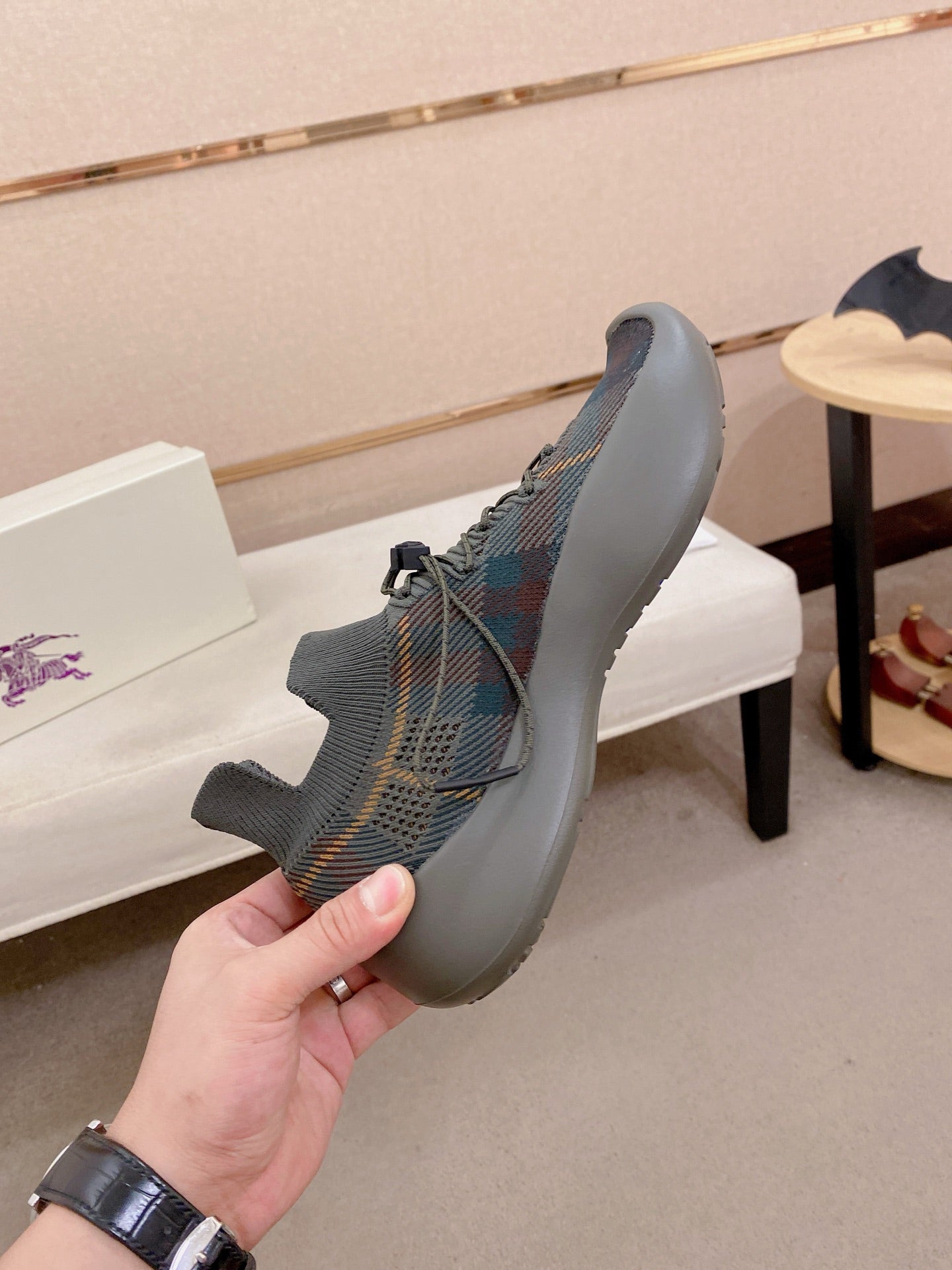 Gray knit lace-up sneakers with multicolor upper pattern and blue sole