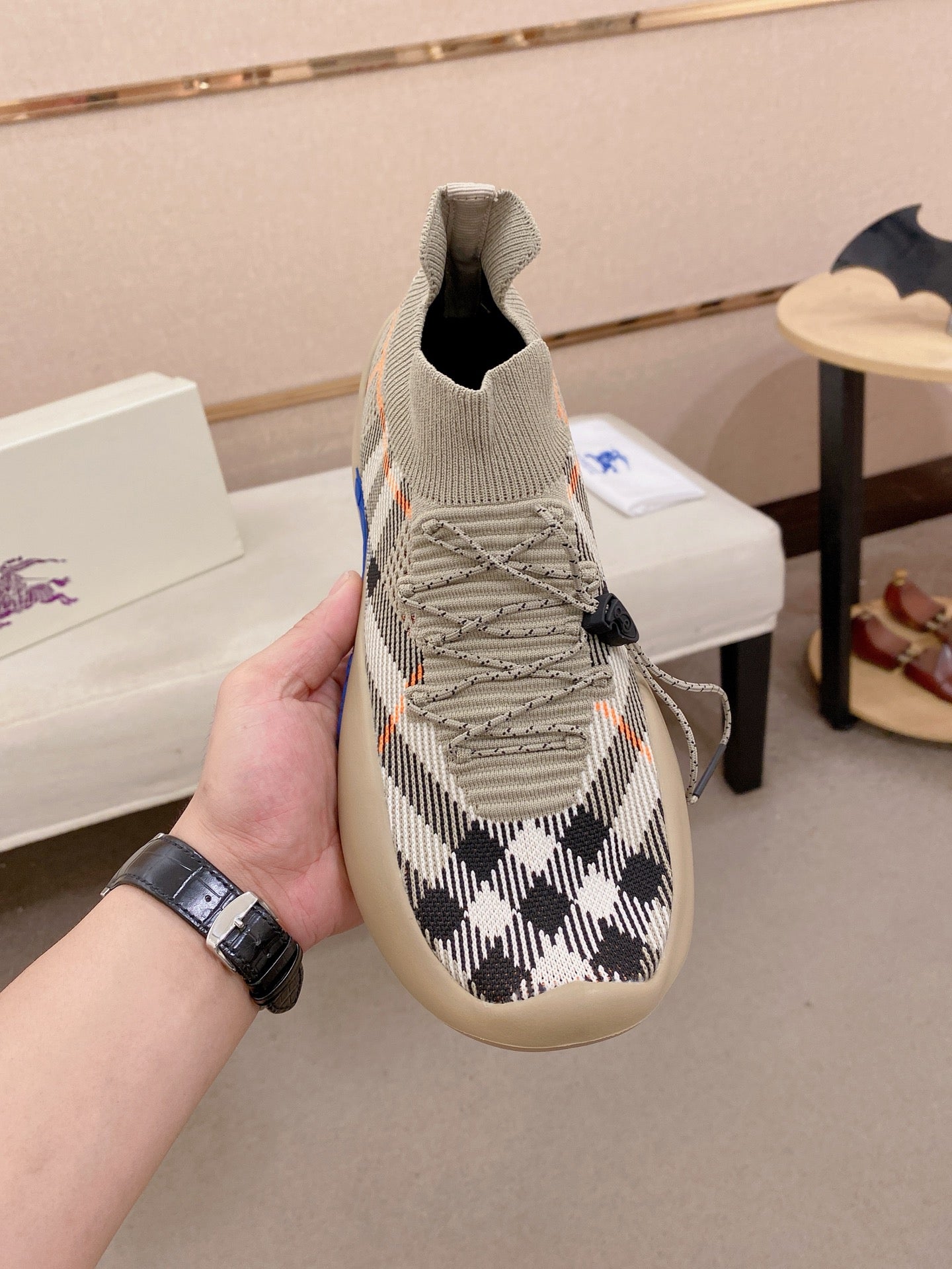 Knit slip-on sneaker with beige and black check upper, lace detail, blue sole