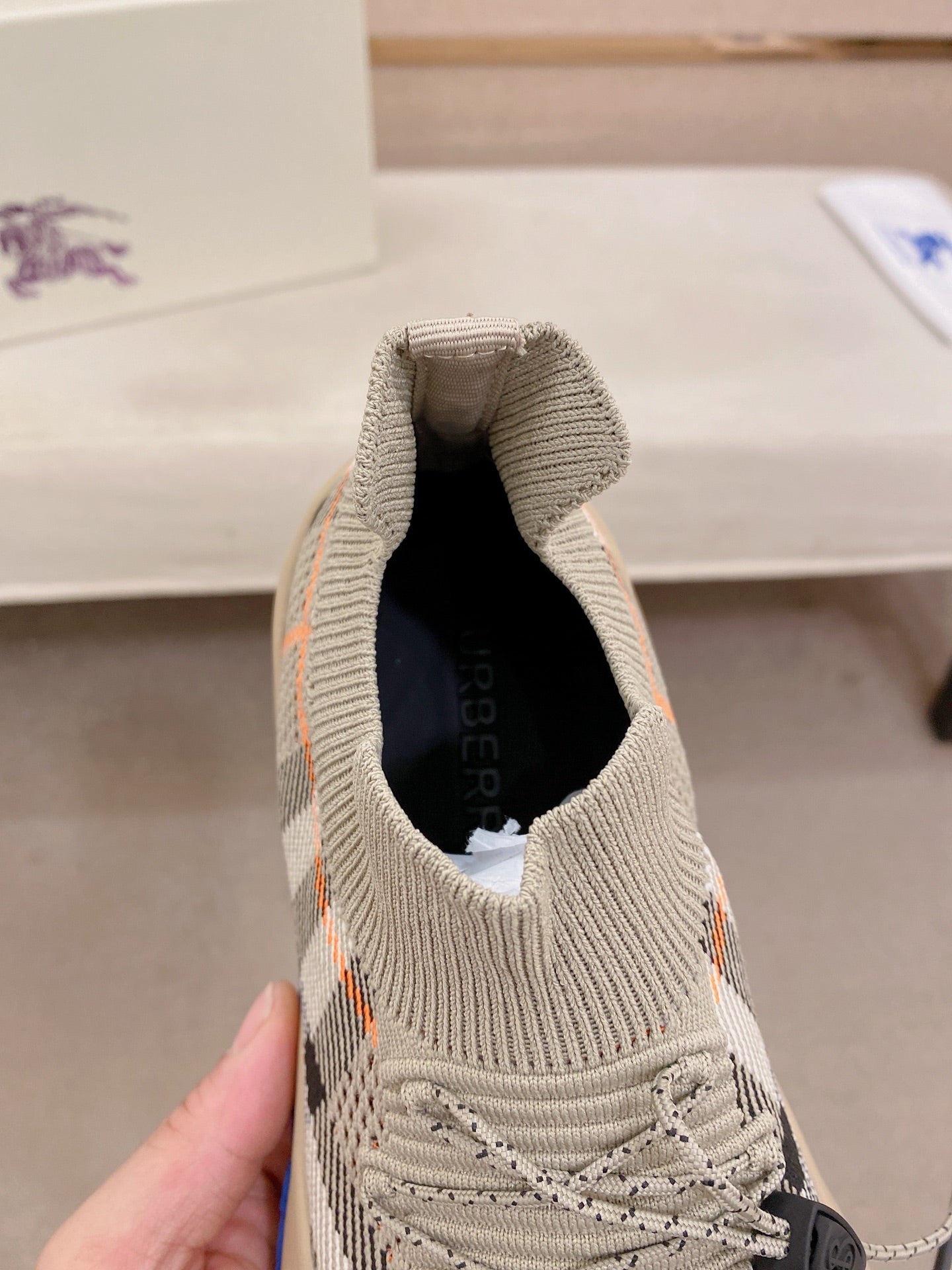 Knit sneaker interior opening with laces, beige upper with check accents
