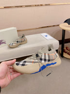 Beige check knit sneaker with blue side accent and lace-up front