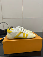 Louis Vuitton sneakers, cream with yellow V-style stripe detail and white laces