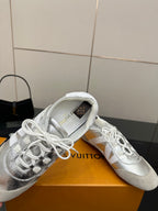Louis Vuitton white leather sneaker close-up, padded collar with white laces