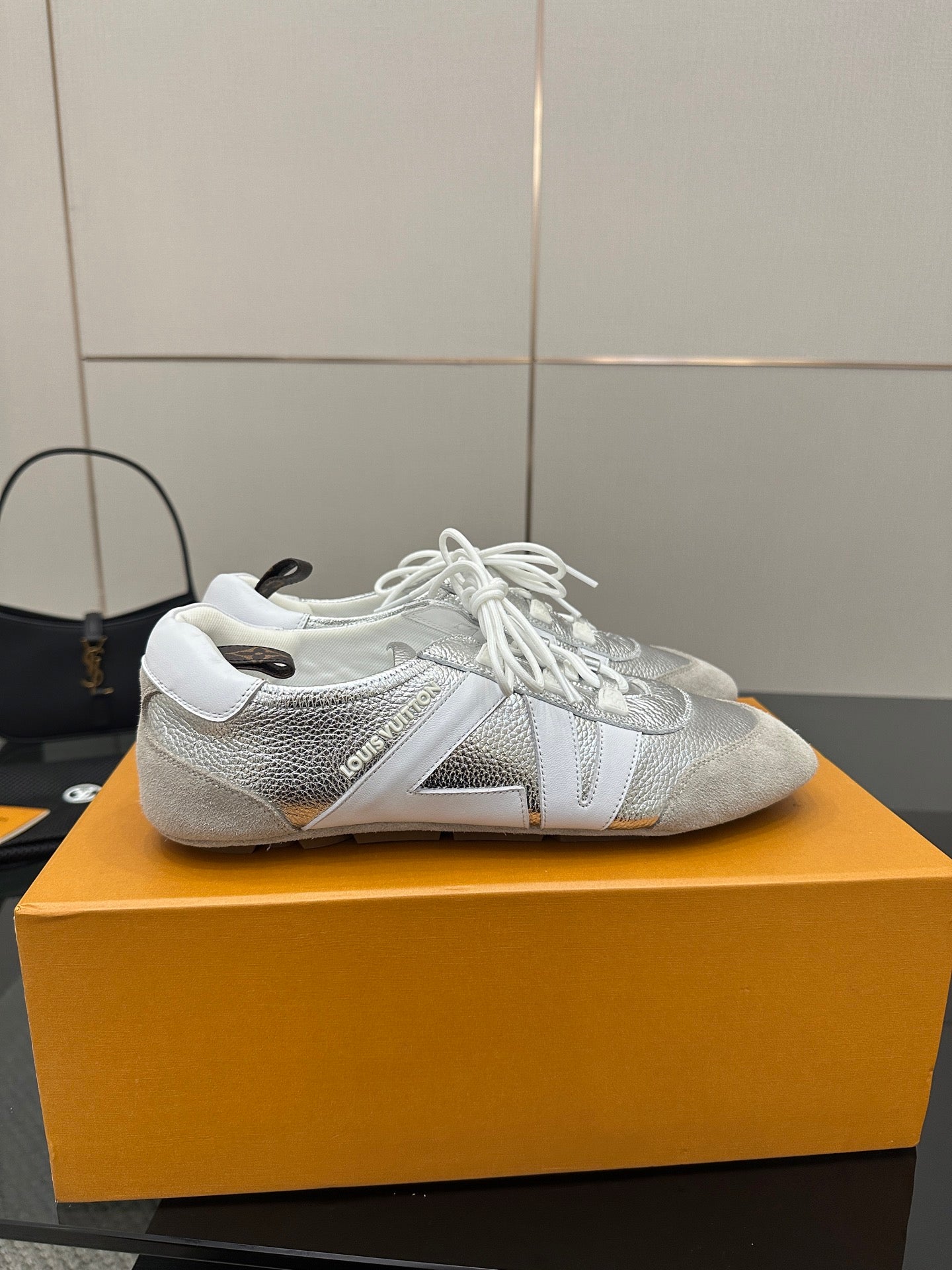 Louis Vuitton white leather sneakers with white laces and embossed logo detail