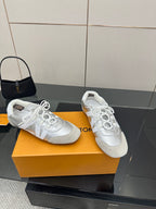 Louis Vuitton white leather lace-up sneakers, toe and side view with white laces