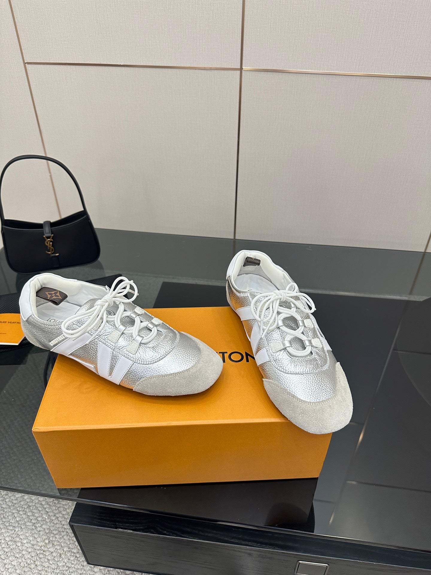 Louis Vuitton white leather lace-up sneakers, toe and side view with white laces