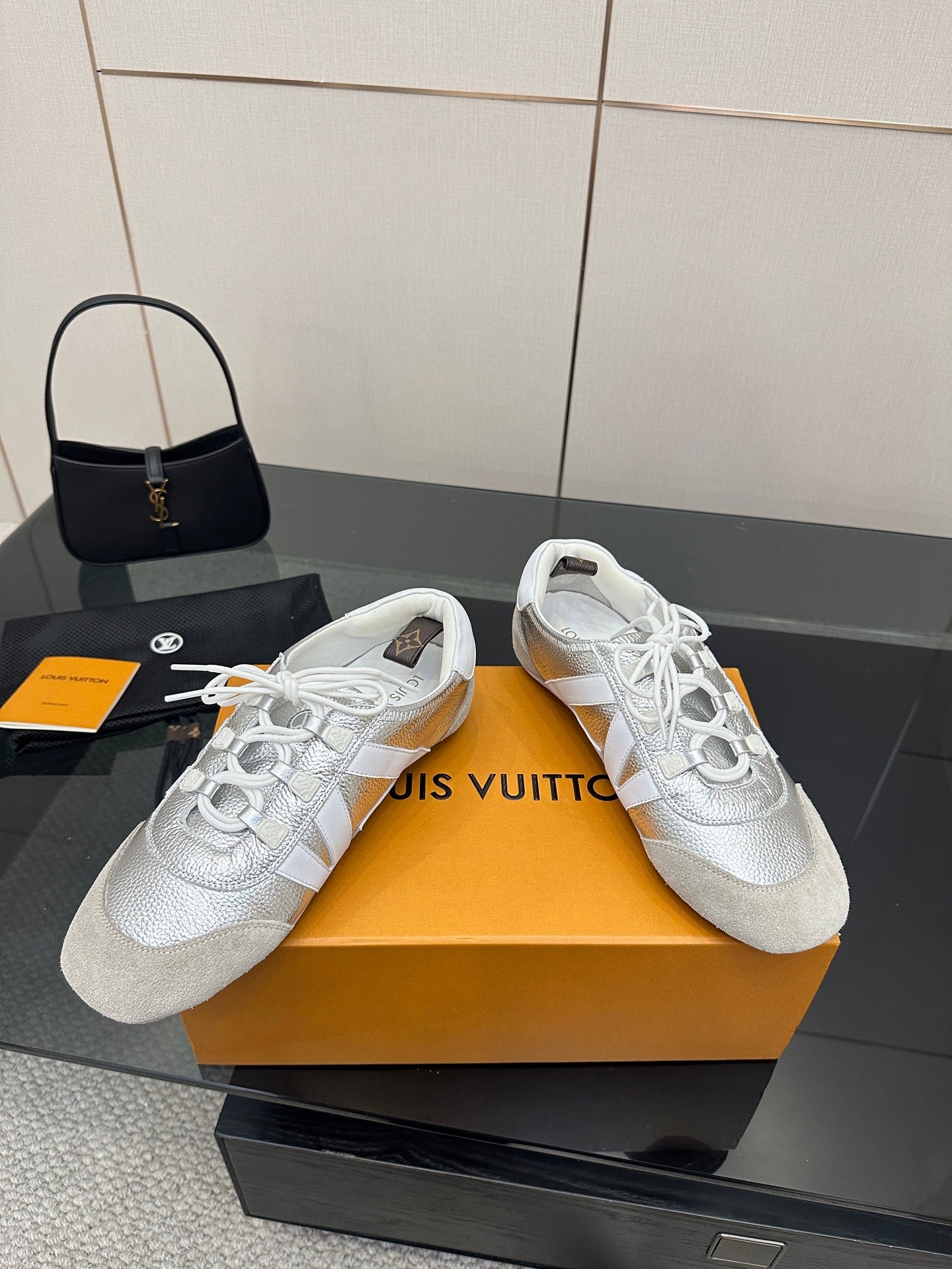 Louis Vuitton white leather low-top sneakers with lace-up front and cushioned tongue