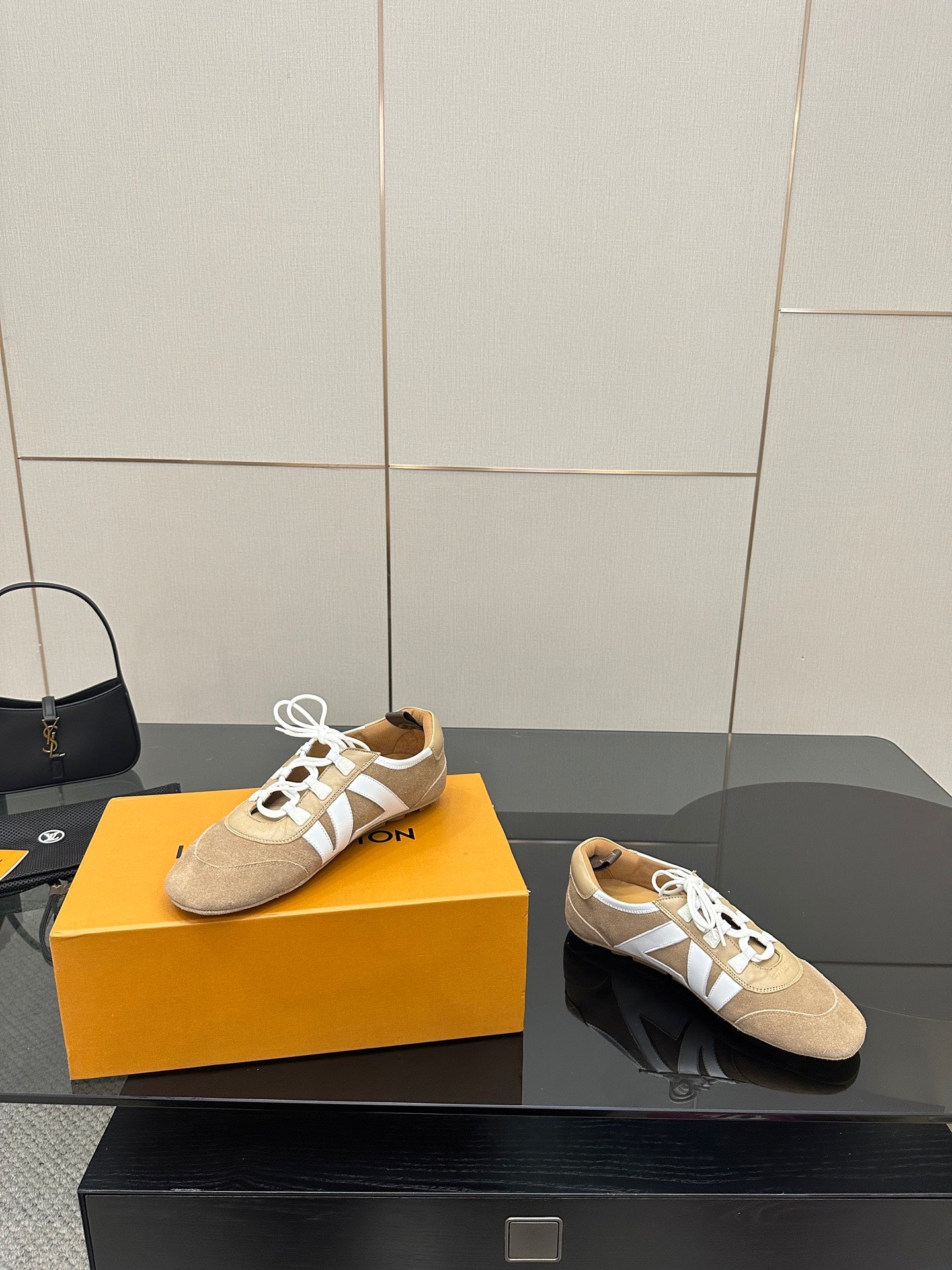 Louis Vuitton women’s beige sneakers on box, front and side views with white laces