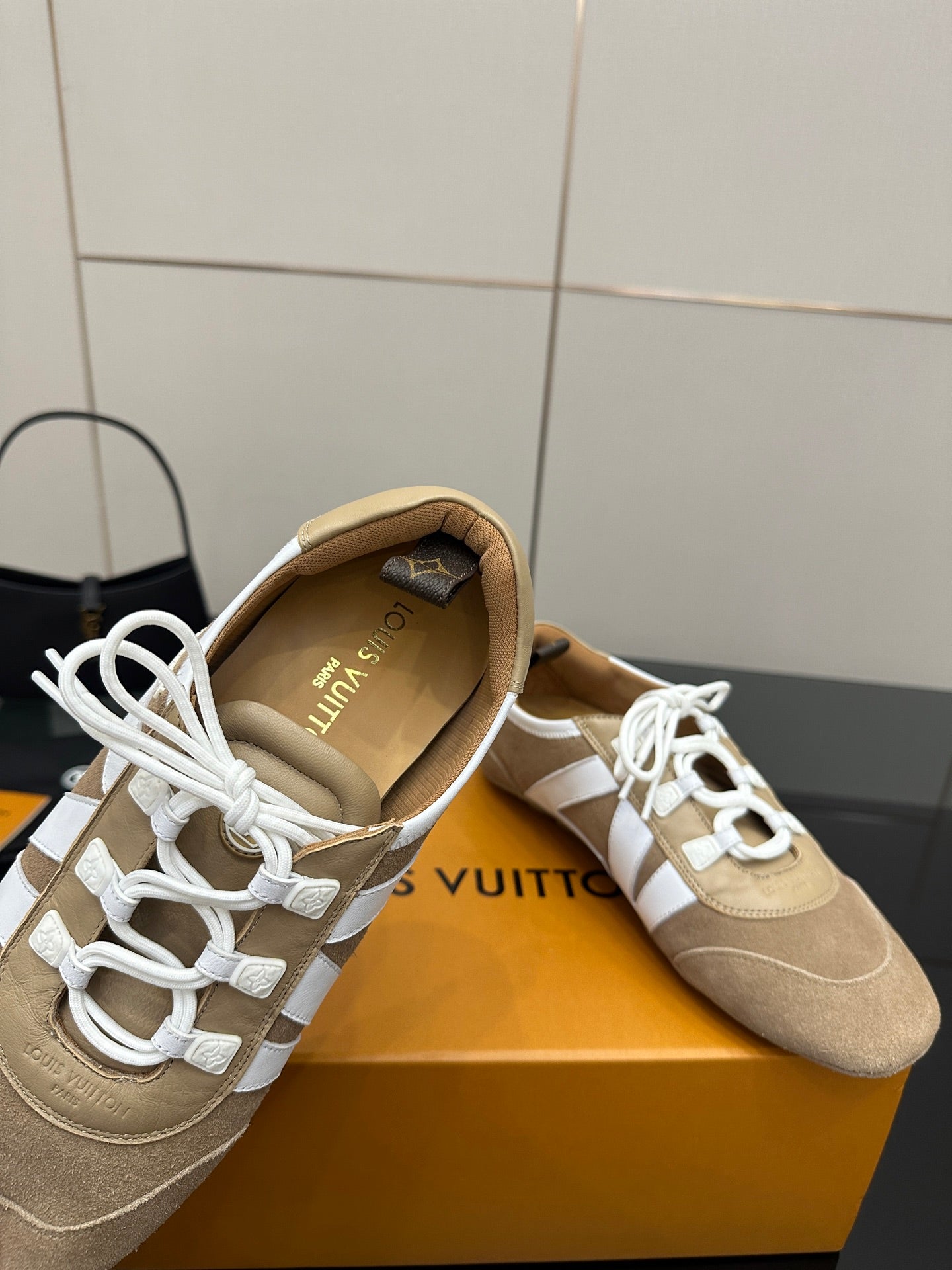 Louis Vuitton women’s beige sneakers, open view showing interior lining and lace-up top