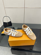 Louis Vuitton women’s beige sneakers with white lace-up closure and side stripe detail