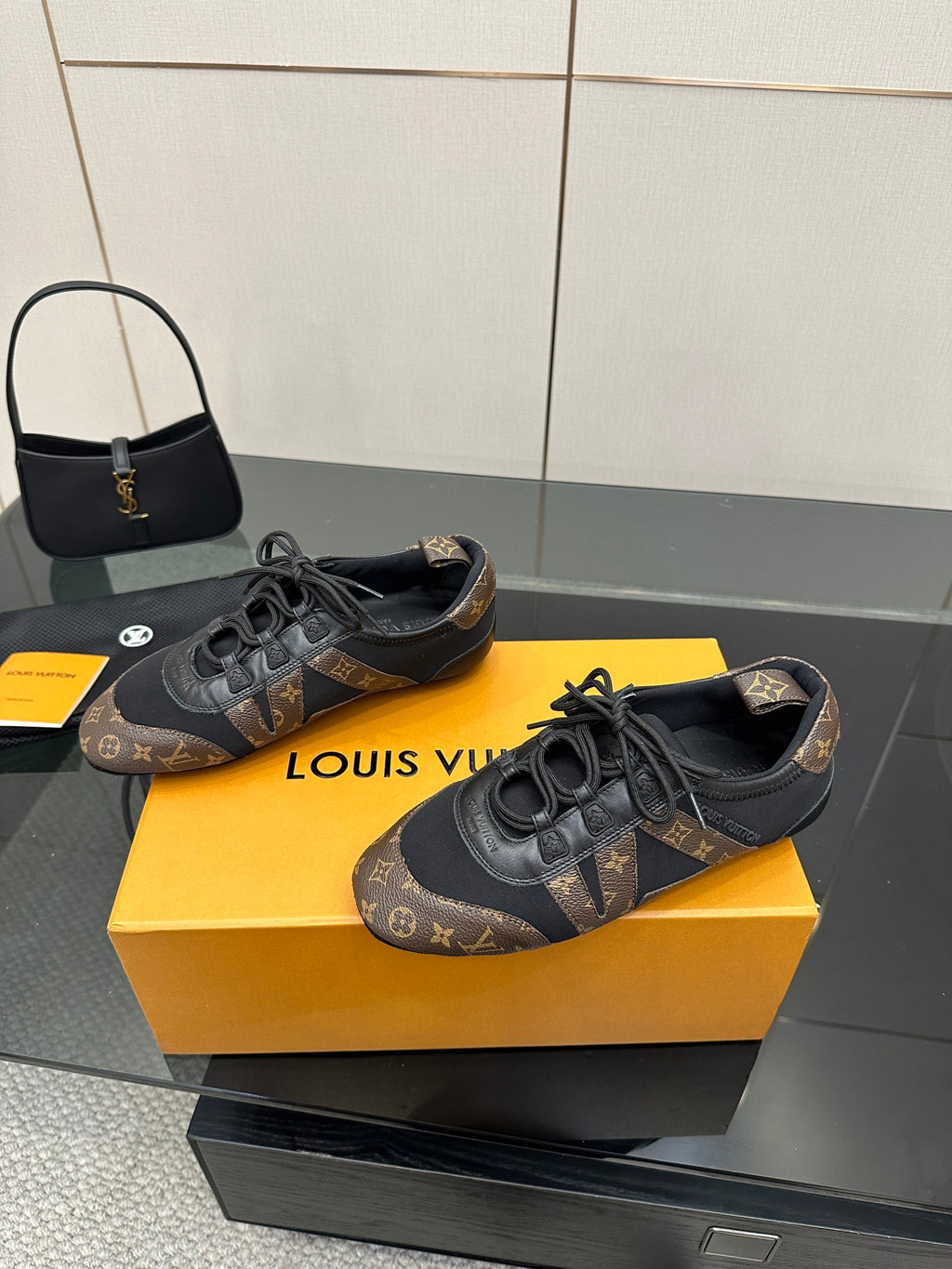 Louis Vuitton lace-up sneakers, dark blue-gray monogram upper and black eyelets