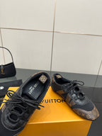 Louis Vuitton lace-up sneakers with cushioned tongue, dark monogram uppers