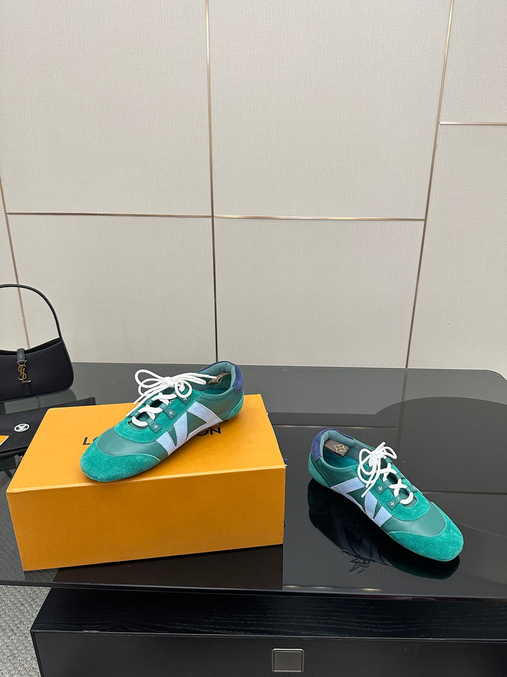 Teal low-top sneakers with white laces, side stripe detail, plus matching dark pair
