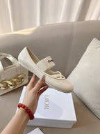 Light cream Dior ballerina flat with elastic strap and logo insole detail