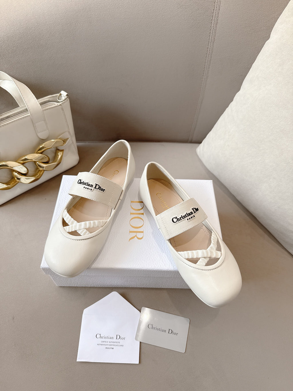 Ladies Dior ballet flats in light cream with elastic strap and textured toe panel
