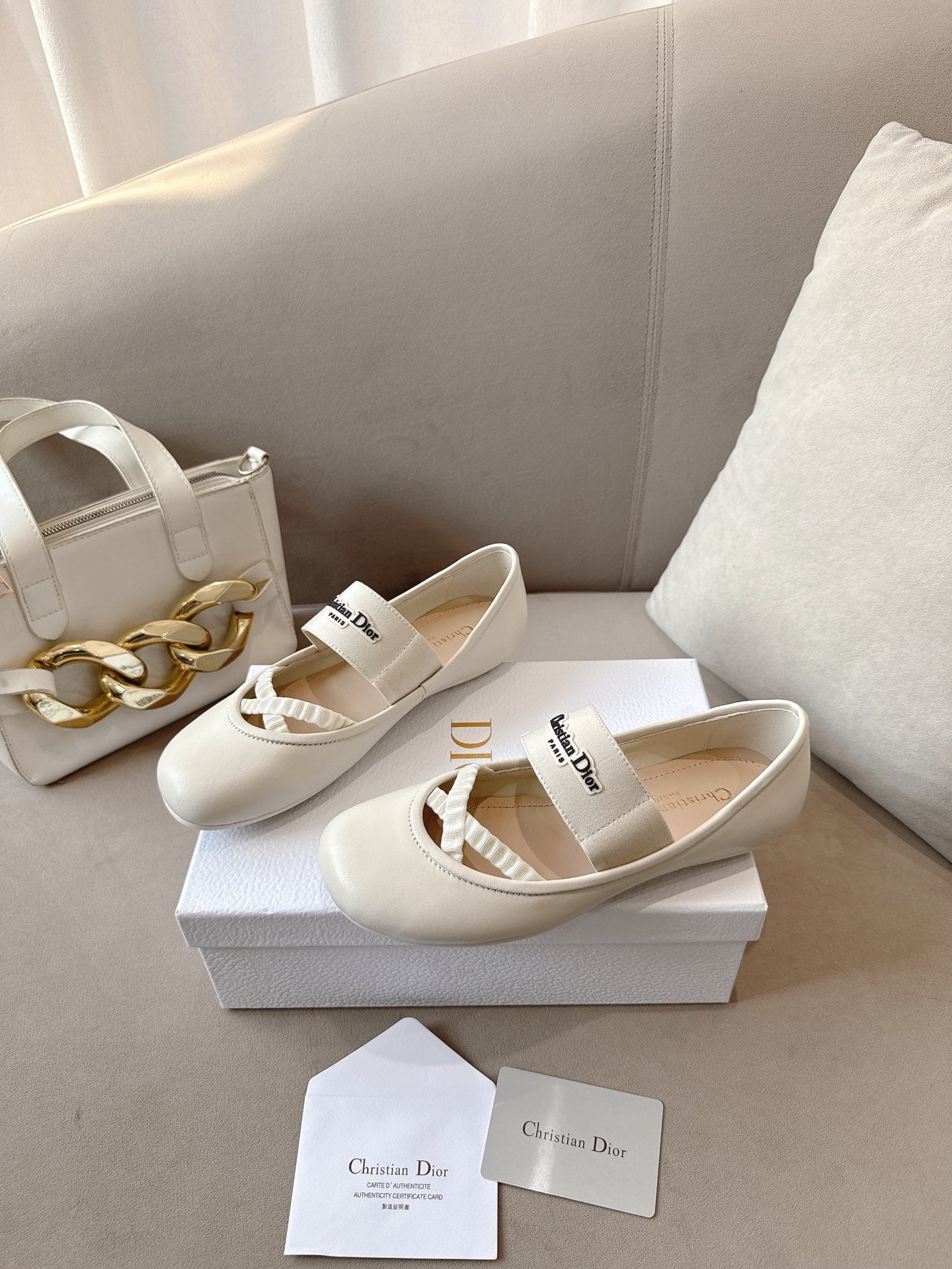 Ladies Dior ballerina flats in light cream with elastic strap and round toe