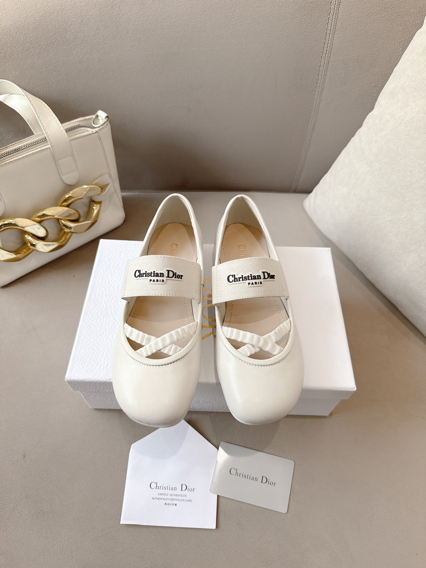 Ladies Dior ballet flats in light cream with round toe and logo strap detail