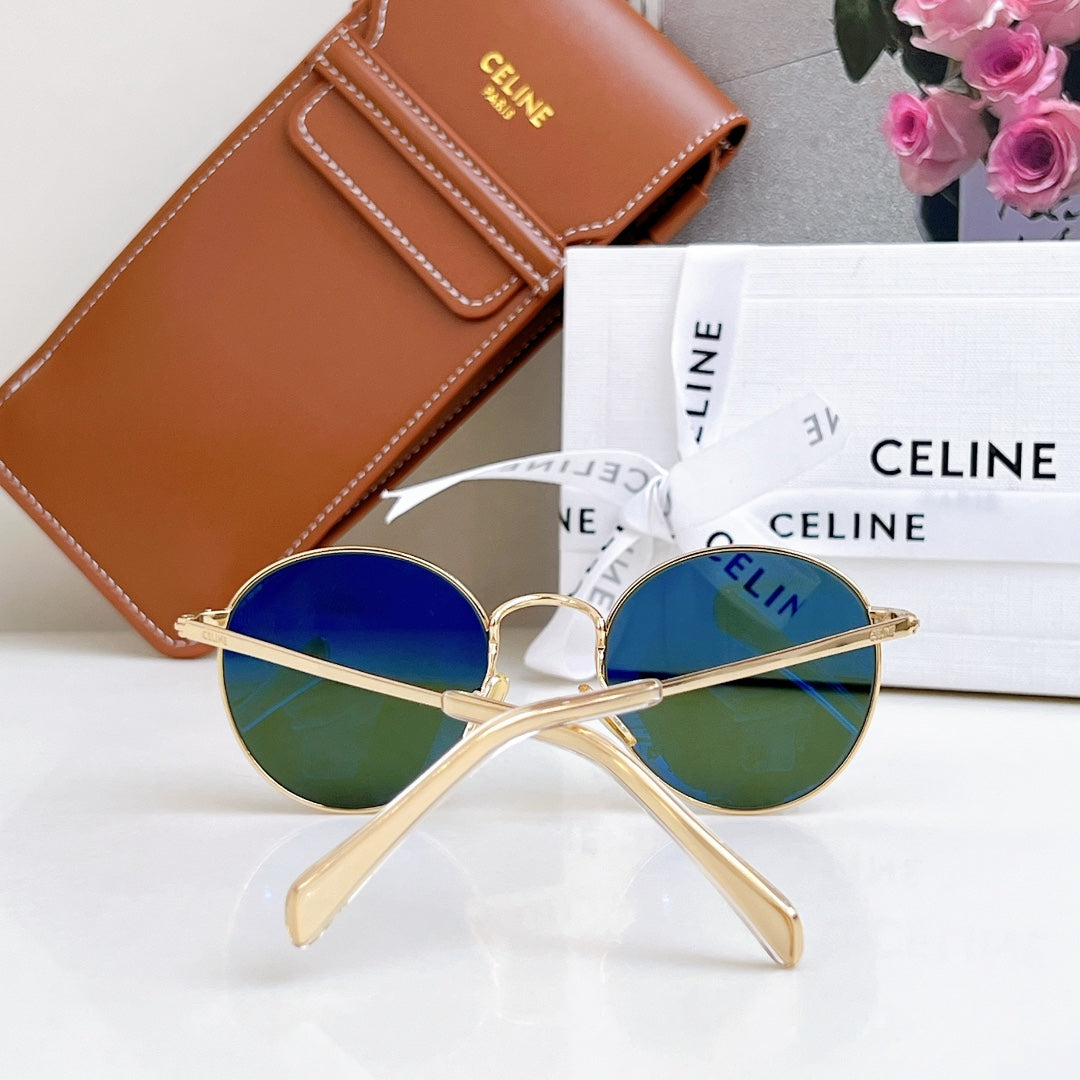Celine round sunglasses with gold frame and blue lenses with green tint