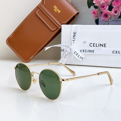 Round gold sunglasses with green tinted lenses, side view