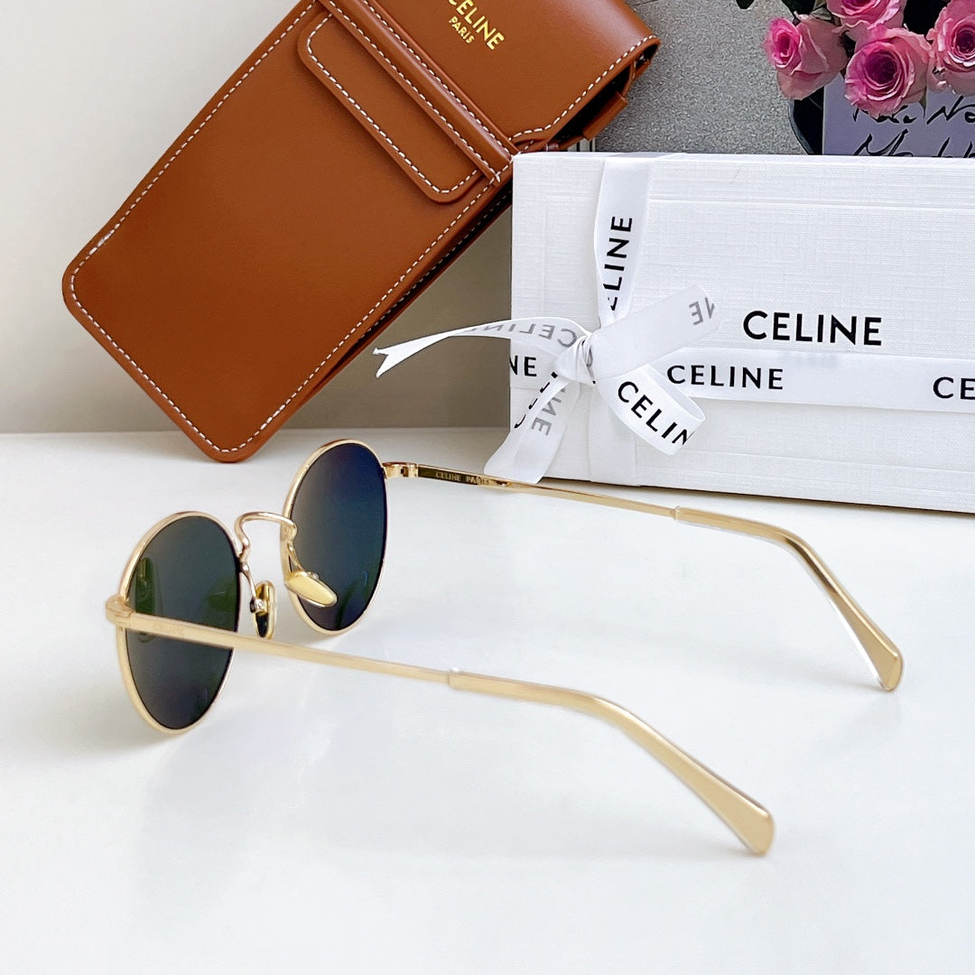 Round gold sunglasses with dark lenses, angled view