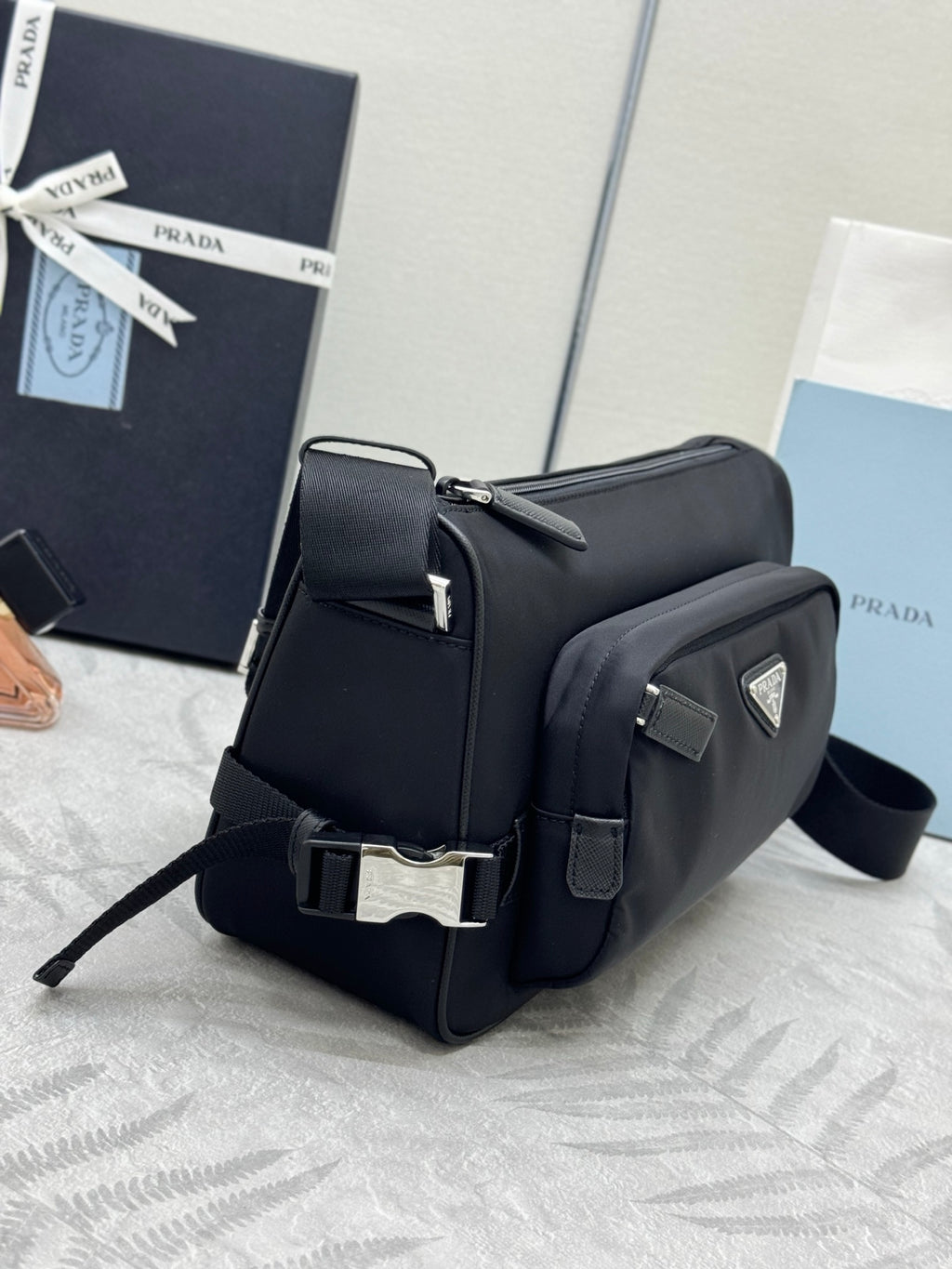 Prada small backpack-style bag, black exterior with flap and metal logo plaque
