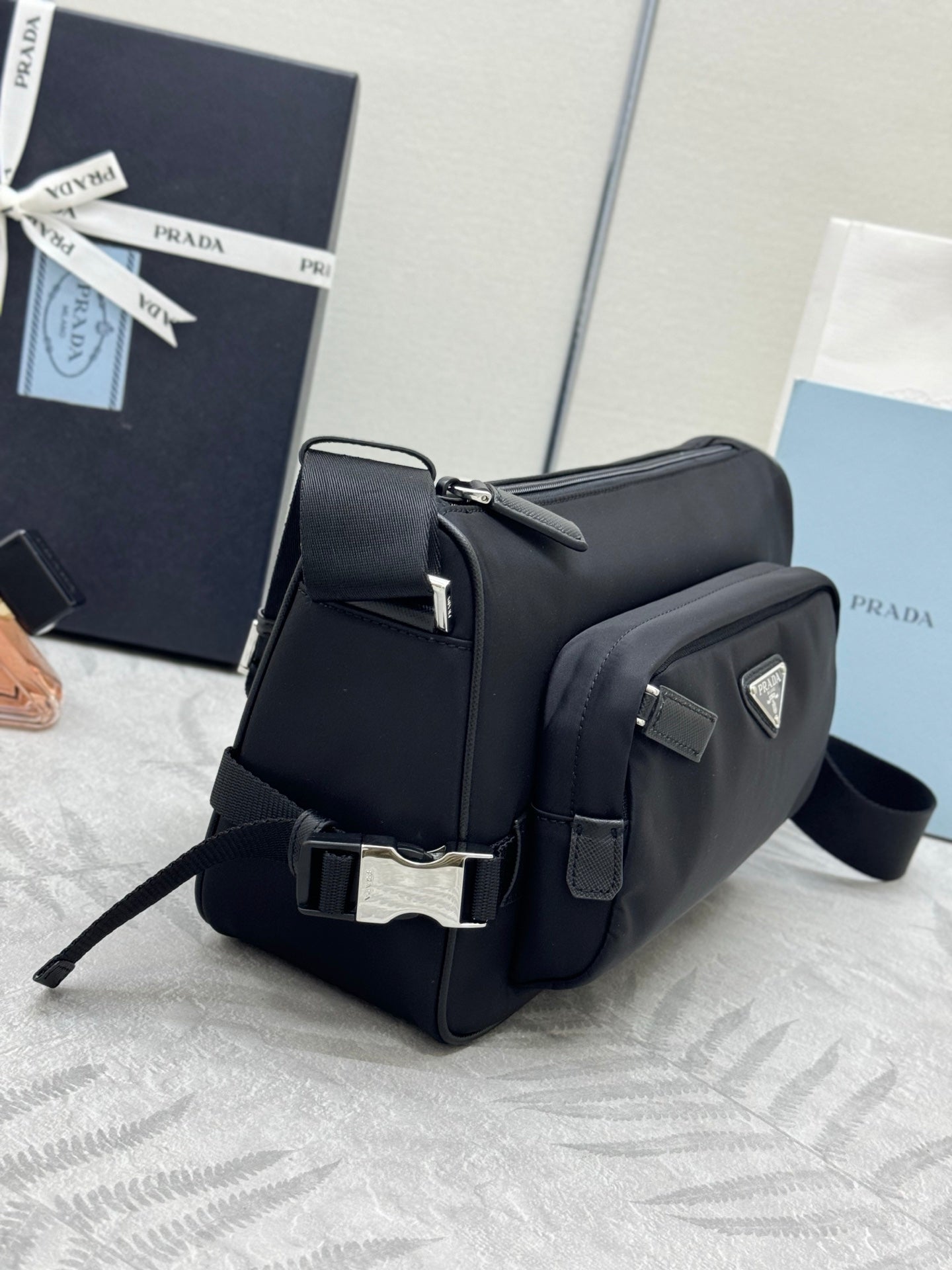 Prada small backpack-style bag, black exterior with flap and metal logo plaque