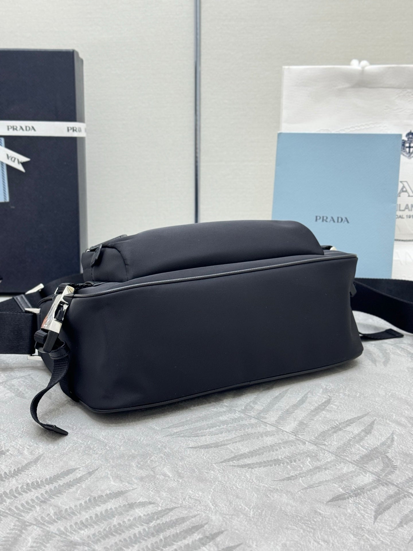 Prada shoulder bag, black with smooth back panel and front strap attachments