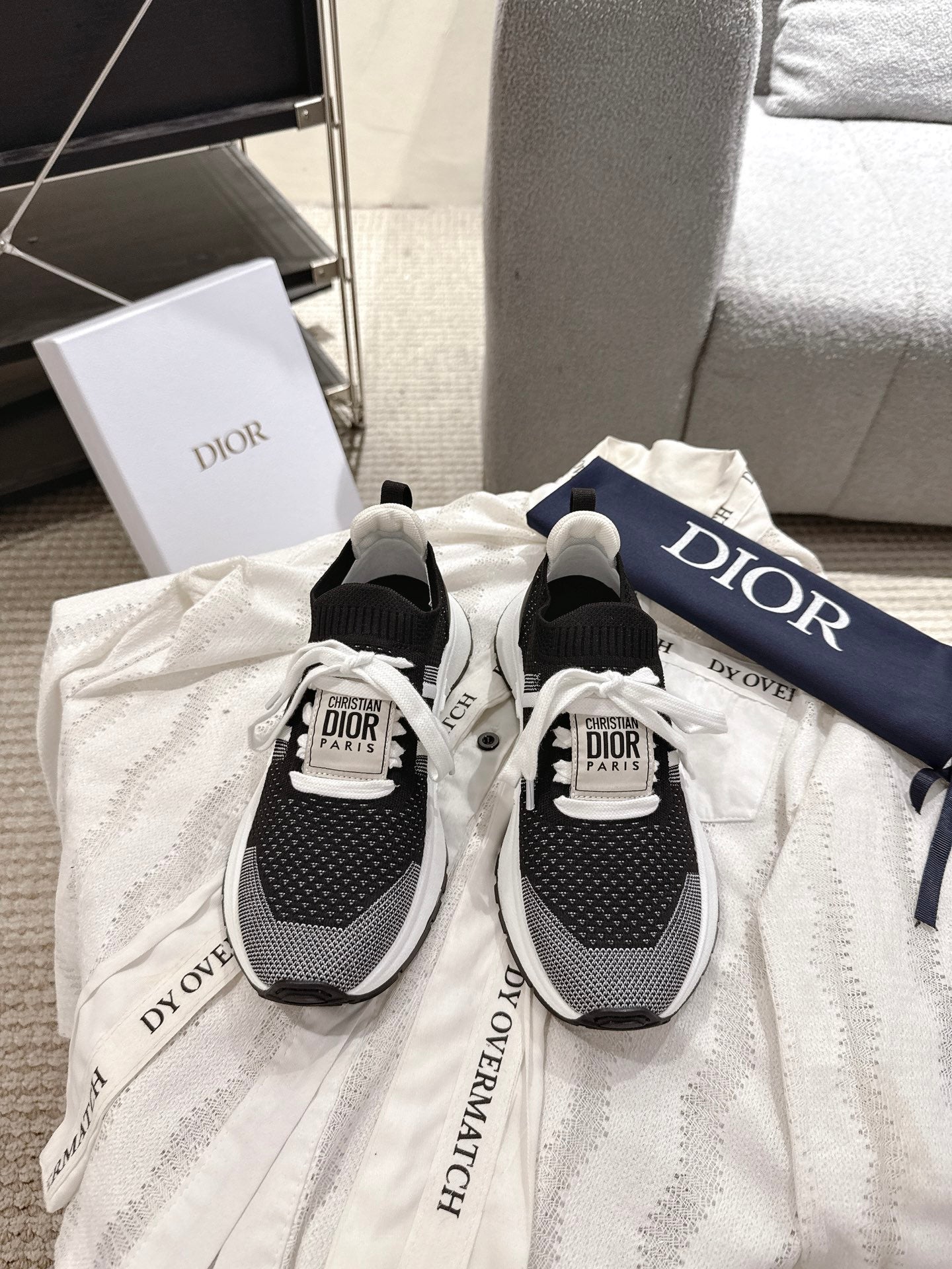 Unisex Dior sneakers, black knit upper with white sole and lace-up design