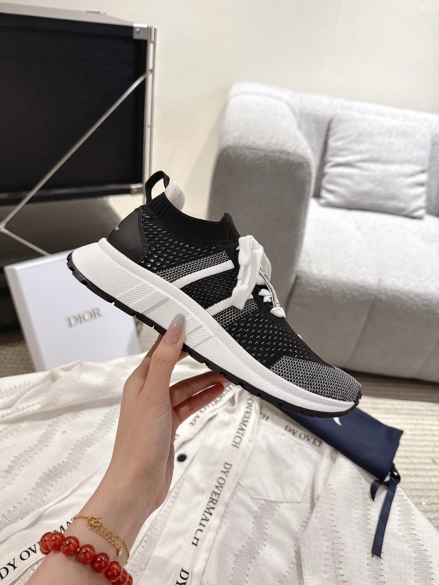 Unisex Dior sneaker, black knit upper with white sole and lace-up