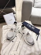 White mesh lace-up sneakers with black heel stripe and Dior logo on navy strap