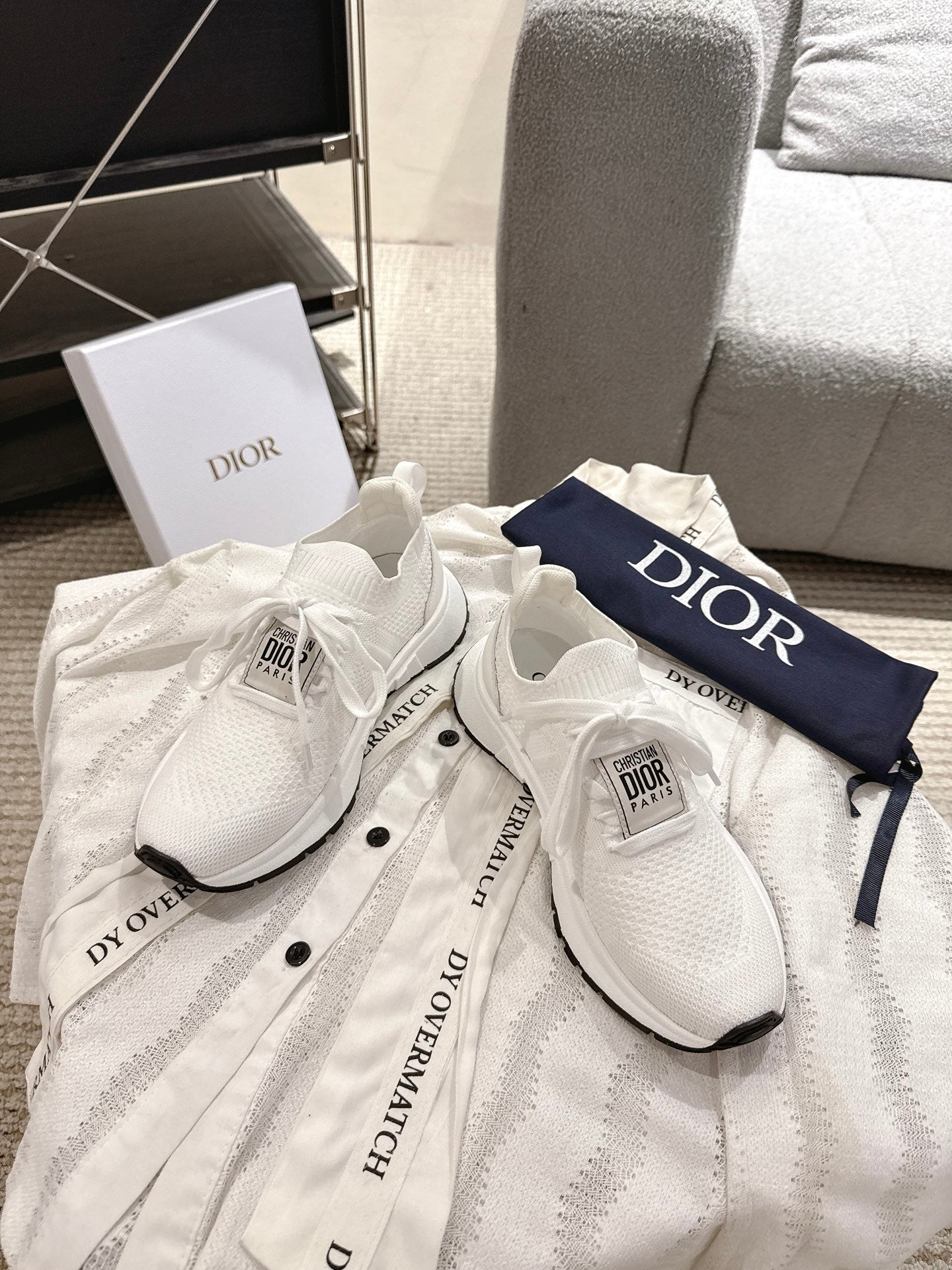 Dior unisex white sneakers on bag, textured knit uppers with black detail accents