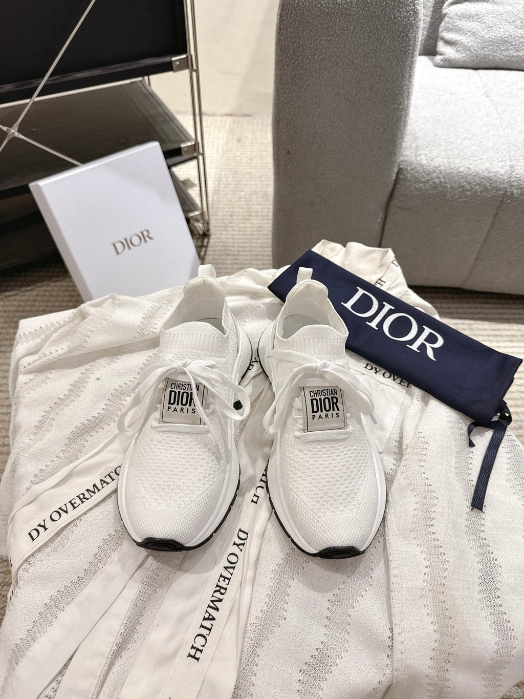 Dior unisex white sneakers with knit upper, black accents, and lace-up design