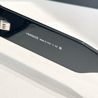 Close-up of black eyeglass temple with VERSACE and “MADE IN ITALY” text