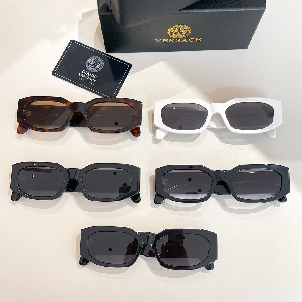 Multiple eyeglass frames laid out: tortoiseshell, white, black, and dark styles