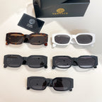 Multiple eyeglass frames laid out: tortoiseshell, white, black, and dark styles