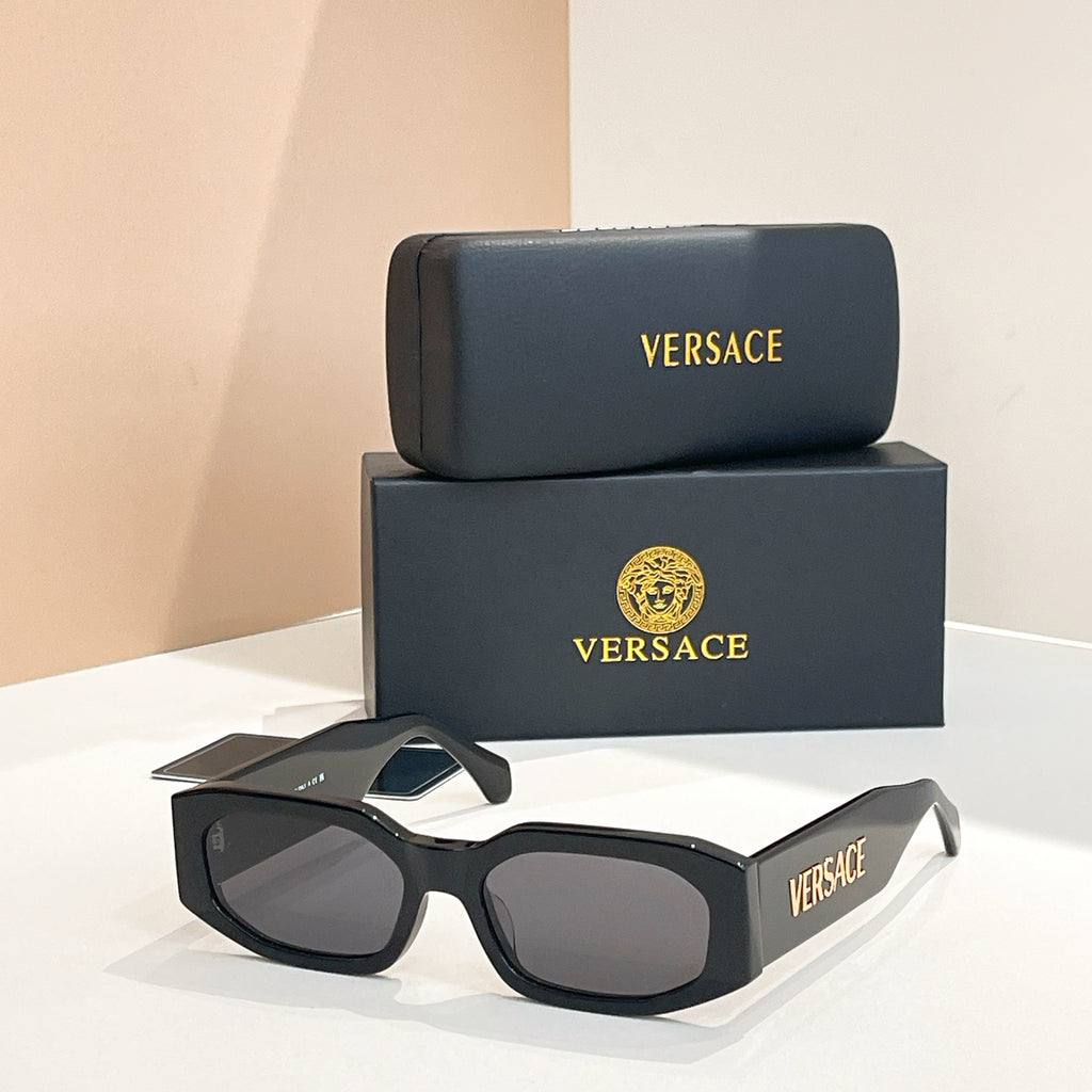 Black acetate sunglasses with dark lenses and VERSACE logo on the temples