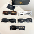 Assorted VERSACE glasses set with black, tortoiseshell, and white frames